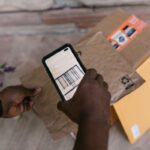 phone scanning a barcode on a package